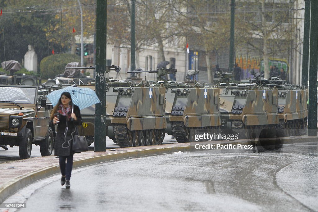 US M113 armored personnel carriers are lined up the street...