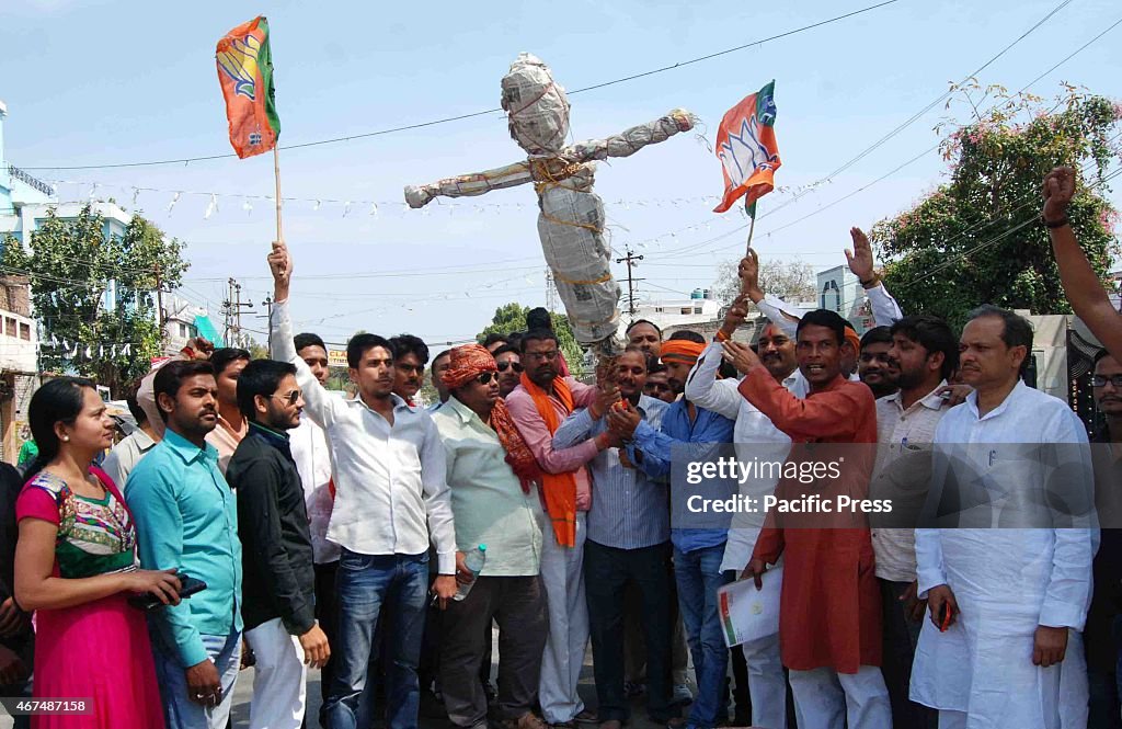 BJP workers shouting slogans and burning effigy of UP chief...