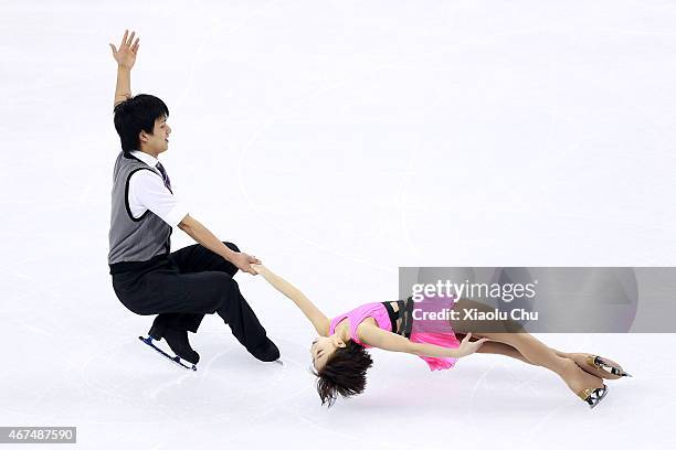 Narumi Takahashi and Ryuichi Kihara of Japan perform during the Pairs Short Program on day one of the 2015 ISU World Figure Skating Championships at...