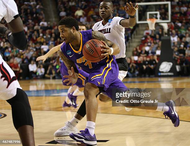 Deon Mitchell of the UNI Panthers drives against the Louisville Cardinals during the third round of the 2015 Men's NCAA Basketball Tournament at Key...