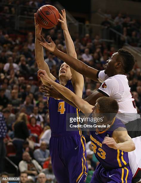 Paul Jesperson of the UNI Panthers rebounds against Chinanu Onuaku of the Louisville Cardinals during the third round of the 2015 Men's NCAA...