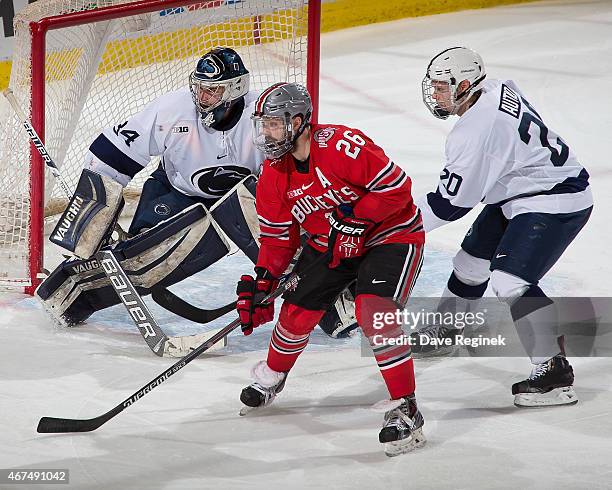 Matt Johnson of the Ohio State Buckeyes sets up in front of Erik Autio and Eamon McAdam of the Penn State Nittany Lions during game one of Big Ten...