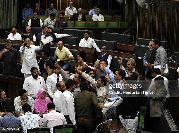 MLAs protesting against National conference MLA Javed Rana remarks against the speaker Kavinder Gupta during a Budget session on March 25, 2015 in...