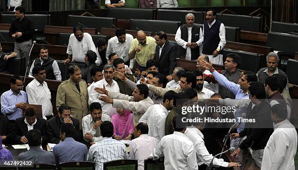 MLAs protesting against National conference MLA Javed Rana remarks against the speaker Kavinder Gupta during a Budget session on March 25, 2015 in...
