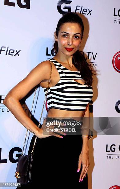 Indian Bollywood actress Malaika Arora Khan poses as she attends an event in Mumbai late February 6, 2014. AFP PHOTO/STR