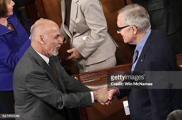 Afghanistan's President Ashraf Ghani greets Senate Minority Leader Harry Reid before delivering his address to a joint meeting of the U.S. Congress...