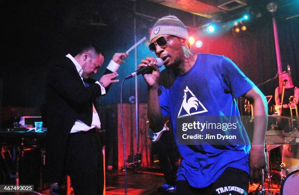 Producer Dan the Automator and rapper Del the Funky Homosapien of alternative hip hop supergroup Deltron 3030 perform live on stage with a 16-piece...