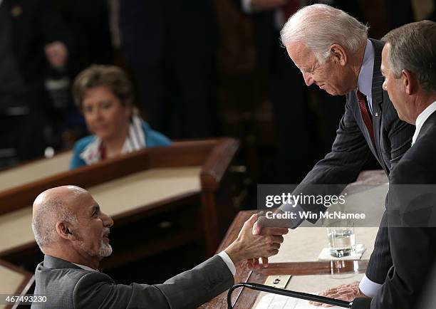 Afghanistan's President Ashraf Ghani shakes hands with U.S. Vice President Joe Biden and Speaker of the House John Boehner after delivering an...