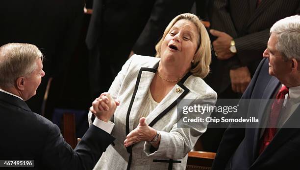 Sen. Lindsey Graham greets Rep. Ileana Ros-Lehtinen before Afghanistan President Ashraf Ghani's address to a joint meeting of the United States...