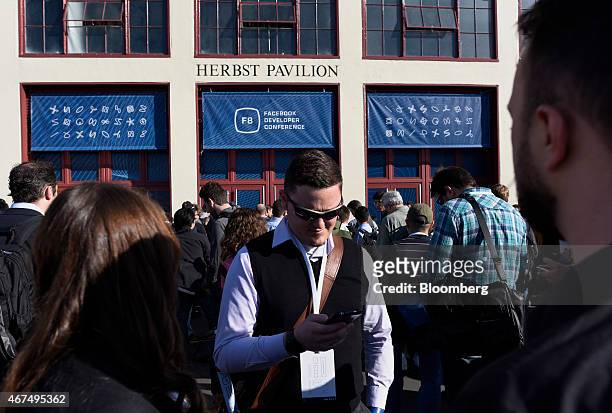 Attendees wait in line before the start of the Facebook Inc. F8 Developers Conference in San Francisco, California, U.S., on Wednesday, March 25,...