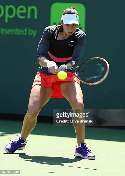 Christina McHale of the United States plays a backhand against Sorana Cirstea of Romania in their first round match during the Miami Open at Crandon...