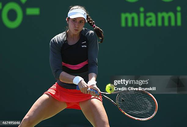 Christina McHale of the United States plays a backhand to Sorana Cirstea of Romania in their first round match during the Miami Open at Crandon Park...