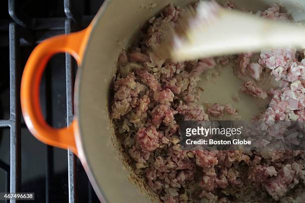 Food blogger Jennifer Che makes Taiwanese beef stew on rice in the kitchen of her Cambridge, Mass. Home. Here, she browns the ground beef and...