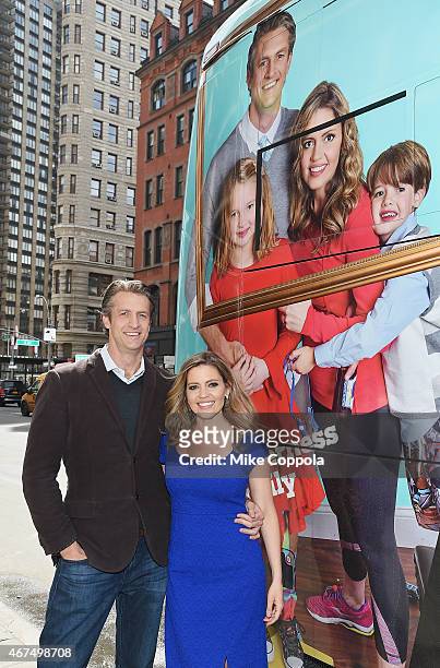 Penn Holderness and wife Kim Holderness pose for a picture at Up Tv's "The Holderness Family" Photo Call on March 25, 2015 in New York City.