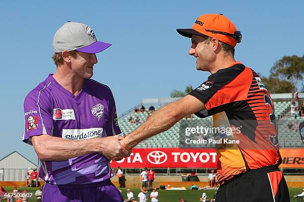 George Bailey of the Hurricanes and Simon Katich of the Scorchers shake hands after the coin toss during the Big Bash League Final match between the...