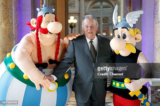 Cartoonist Albert Uderzo of France poses with Asterix and Obelix prior to a press conference at the Monnaie de Paris on March 25 in Paris, France. A...