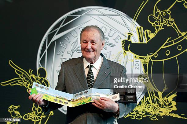 Cartoonist Albert Uderzo of France poses with a new series of twelve coin pieces illustrated with Asterix prior to a press conference at the Monnaie...