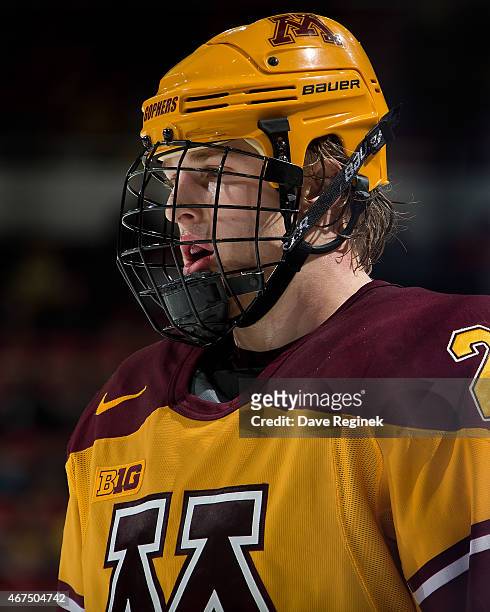 Hudson Fasching of the Minnesota Golden Gophers looks down the ice against the Michigan Wolverines during the finals of Big Ten Mens Ice Hockey...