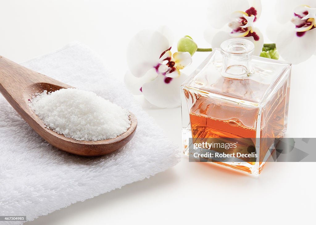 Body scrub and body oil in spa setting