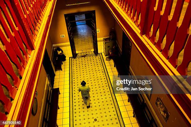 Blind man walks through the foyer of Unión Nacional de Ciegos del Perú, a social club for the visually impaired on April 03, 2013 in Lima. Unión...