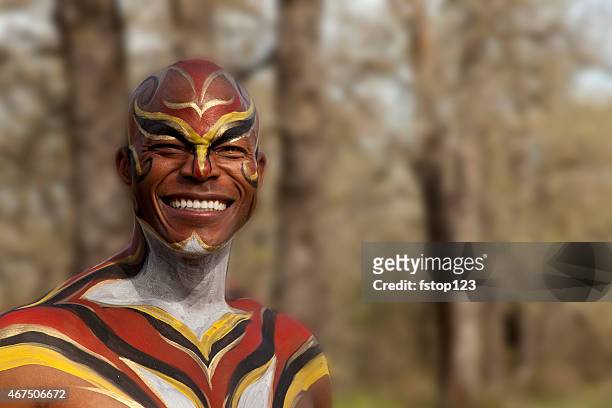 tribal african man with body paint outdoors. hunter, warrior. forest. - african tribal face painting 個照片及圖片檔
