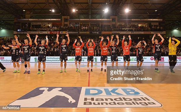 The players of Flensburg celebrate their win after the DKB Bundesliga handball match between SG Flensburg-Handewitt and FA Goeppingen on March 25,...