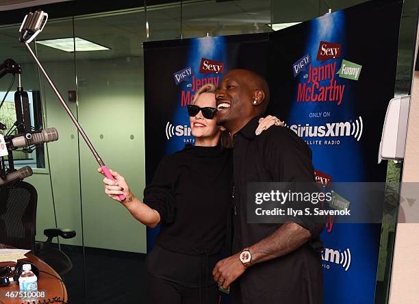 Jenny McCarthy and Tyrese Gibson pose for a selfie during a visit to 'Dirty, Sexy, Funny with Jenny McCarthy' at the SiriusXM Studios on March 25,...