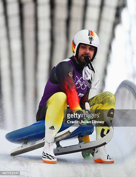 Andi Langenhan of Germany completes a men's luge run during a training session ahead of the Sochi 2014 Winter Olympics at the Sanki Sliding Center on...