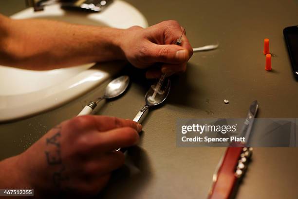 Drugs are prepared to shoot intravenously by a user addicted to heroin on February 6, 2014 in St. Johnsbury Vermont. Vermont Governor Peter Shumlin...