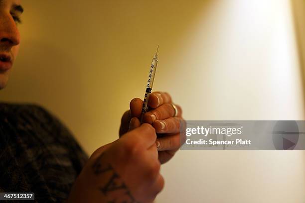 Drugs are prepared to shoot intravenously by a user addicted to heroin on February 6, 2014 in St. Johnsbury Vermont. Vermont Governor Peter Shumlin...