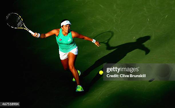 Irina Falconi of the United States runs to play a forehand against Monica Puig of Puerto Rico in their first round match during the Miami Open at...