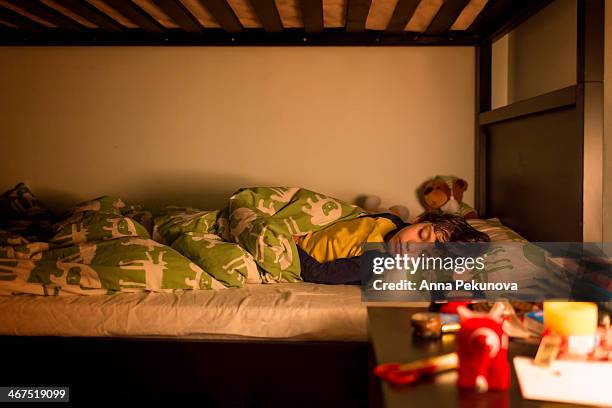 wide view of sleeping boy - litera fotografías e imágenes de stock