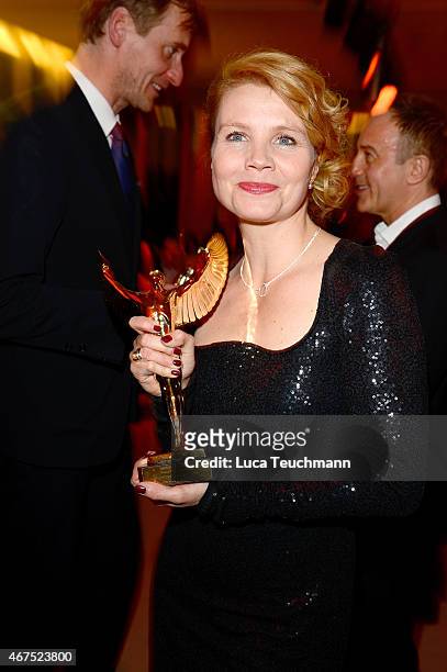 Annette Frier poses with her prize during the Jupiter Award at Cafe Moskau on March 25, 2015 in Berlin, Germany.