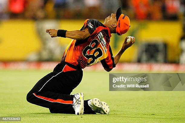 Alfonso Thomas of the Perth Scorchers celebrates after taking a catch to dismiss George Bailey of the Hobart Hurricanes during the Big Bash League...