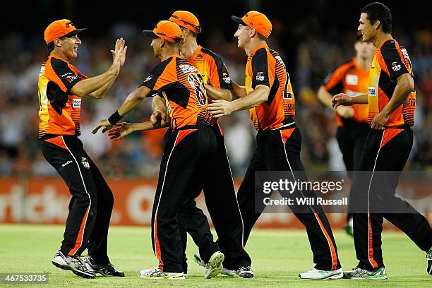 Alfonso Thomas of the Perth Scorchers celebrates after taking a catch to dismiss George Bailey of the Hobart Hurricanes during the Big Bash League...