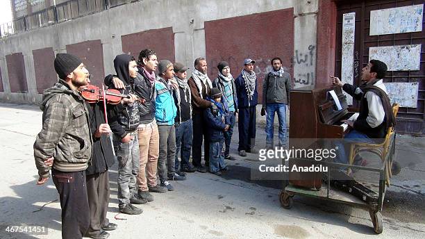 Eyhem Ahmed and other Palestinian musician refugees at Yarmouk camp gather to make them heard around the world by playing piano in the capital...