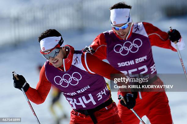 Switzerland's Cross country athletes Jonas Baumann and Curdin Perl train at the Laura Cross Country Skiing Centre of the Sochi Winter Olympics in...