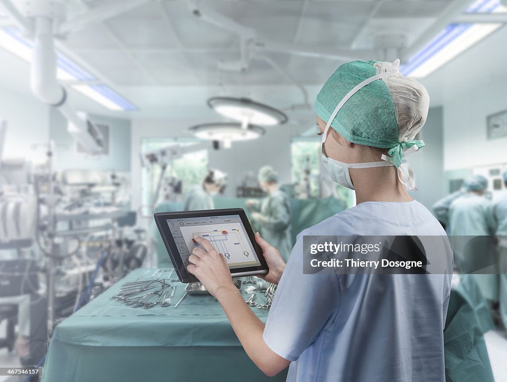 Surgeon using digital tablet