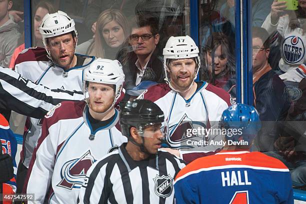 Taylor Hall of the Edmonton Oilers exchanges words with Brad Stuart, Gabriel Landeskog and Jan Hejda of the Colorado Avalanche during the game on...