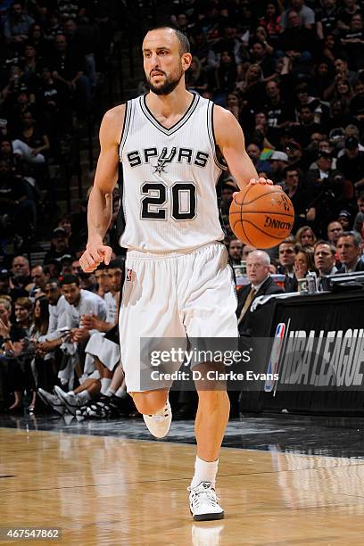 Manu Ginobili of the San Antonio Spurs handles the ball against the Oklahoma City Thunder at the AT&T Center on March 25, 2014 in San Antonio, Texas....