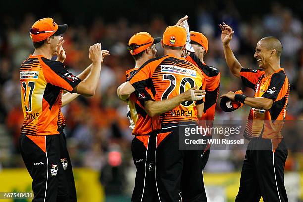 Simon Katich of the Perth Scorchers celebrates after taking a catch to dismiss Dimitri Mascarenhas of the Hobart Hurricanes bowled by Alfonso Thomas...
