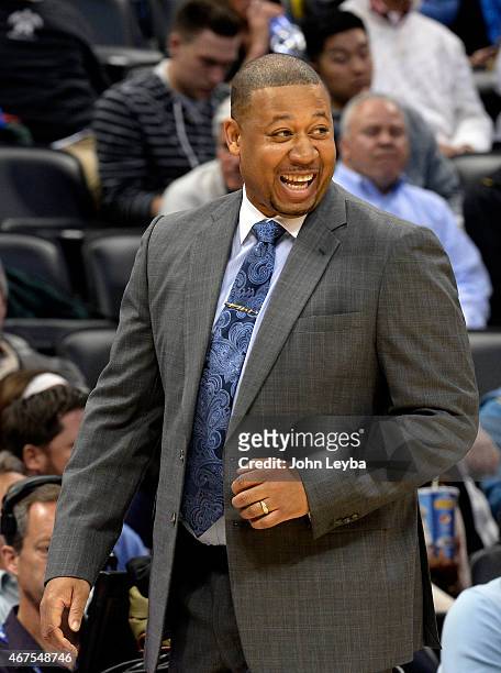 Denver Nuggets head coach Melvin Hunt smiles after a basket by his team against the Philadelphia 76ers March 25, 2015 at Pepsi Center.