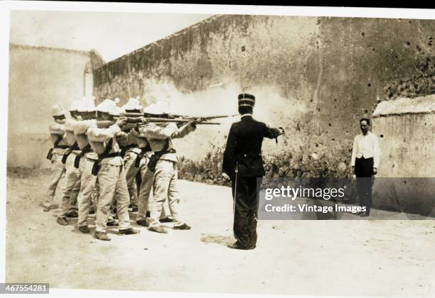 Firing squad execute a prisoner, circa 1890.