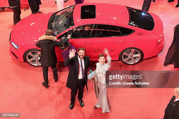 Meret Becker and Alexander Beyer arrive for 'The Grand Budapest Hotel' Premiere and opening ceremony in a Audi car during the 64th Berlinale...