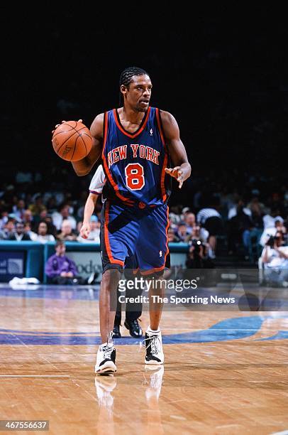 Latrell Sprewell of the New York Knicks moves the ball during the game against the Charlotte Hornets on February 7, 2000 at Charlotte Coliseum in...