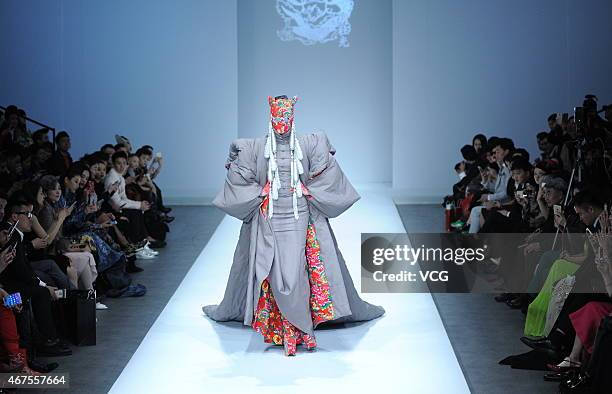 Model walks the runway during the Sheguang Hu show as part of Mercedes-Benz China Fashion Week 2015/2016 Autumn/Winter Collection at Central Hall on...