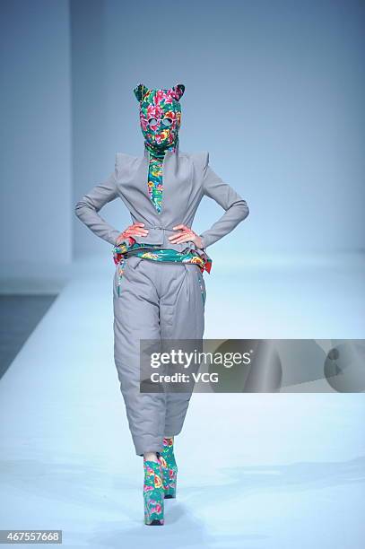 Model walks the runway during the Sheguang Hu show as part of Mercedes-Benz China Fashion Week 2015/2016 Autumn/Winter Collection at Central Hall on...