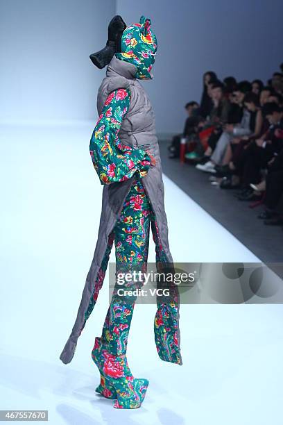 Model walks the runway during the Sheguang Hu show as part of Mercedes-Benz China Fashion Week 2015/2016 Autumn/Winter Collection at Central Hall on...