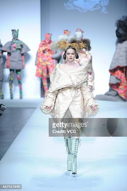 Model walks the runway during the Sheguang Hu show as part of Mercedes-Benz China Fashion Week 2015/2016 Autumn/Winter Collection at Central Hall on...