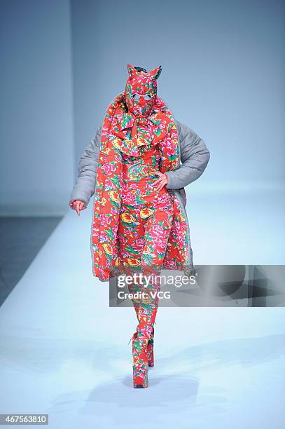 Model walks the runway during the Sheguang Hu show as part of Mercedes-Benz China Fashion Week 2015/2016 Autumn/Winter Collection at Central Hall on...